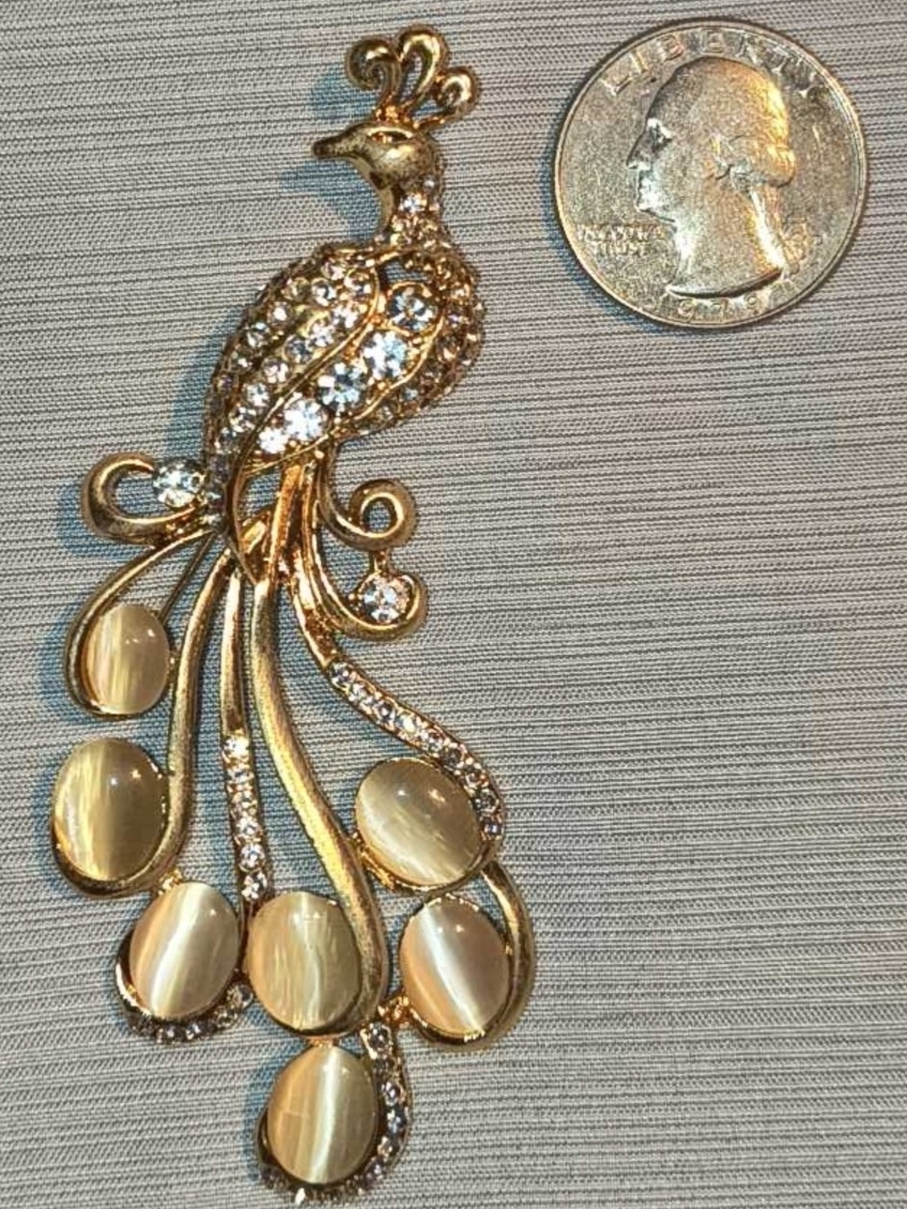 Gold Peacock Brooch with Crystal Accents